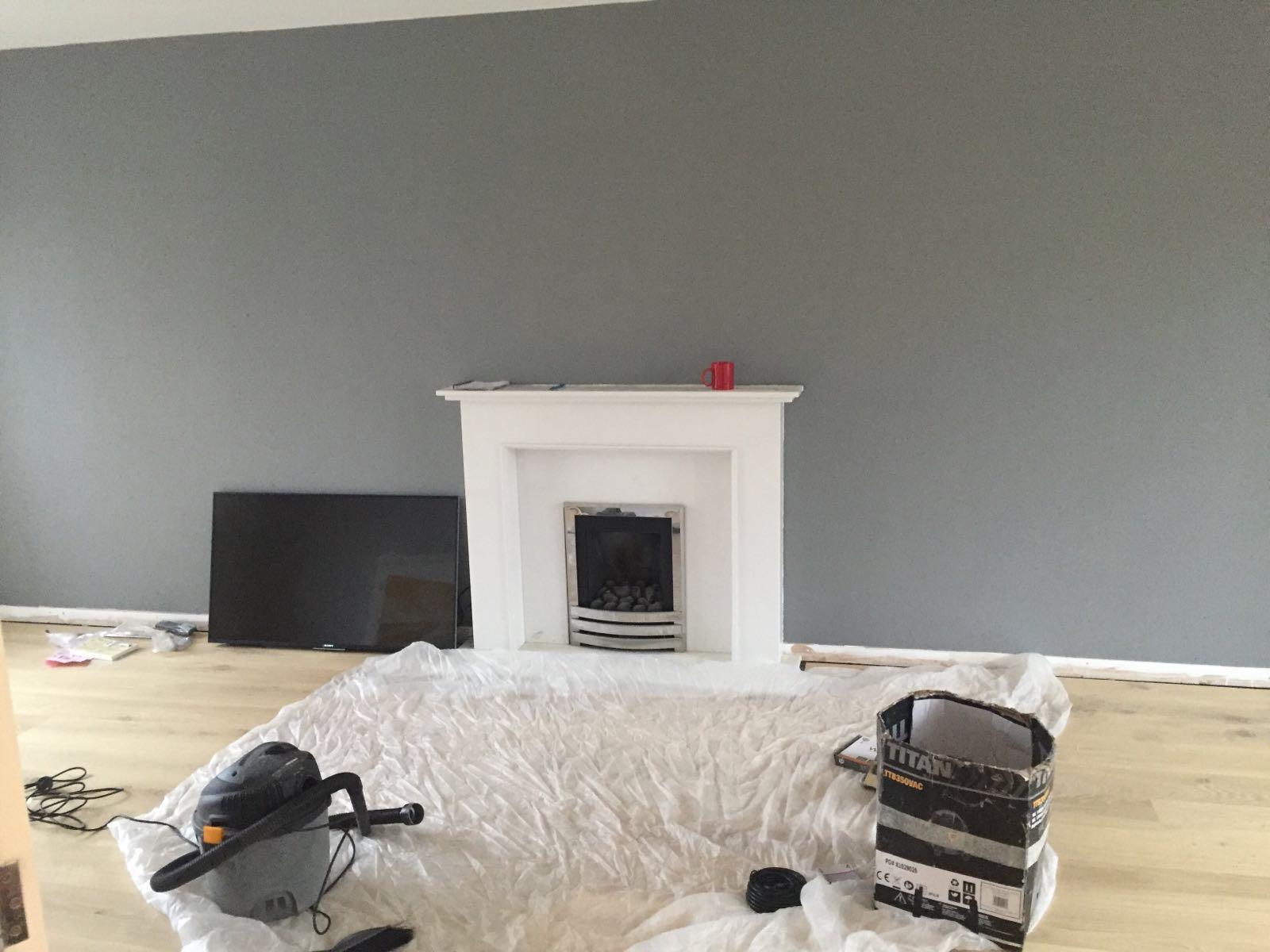 Living room fireplace surround measured up for a TV wall mount above