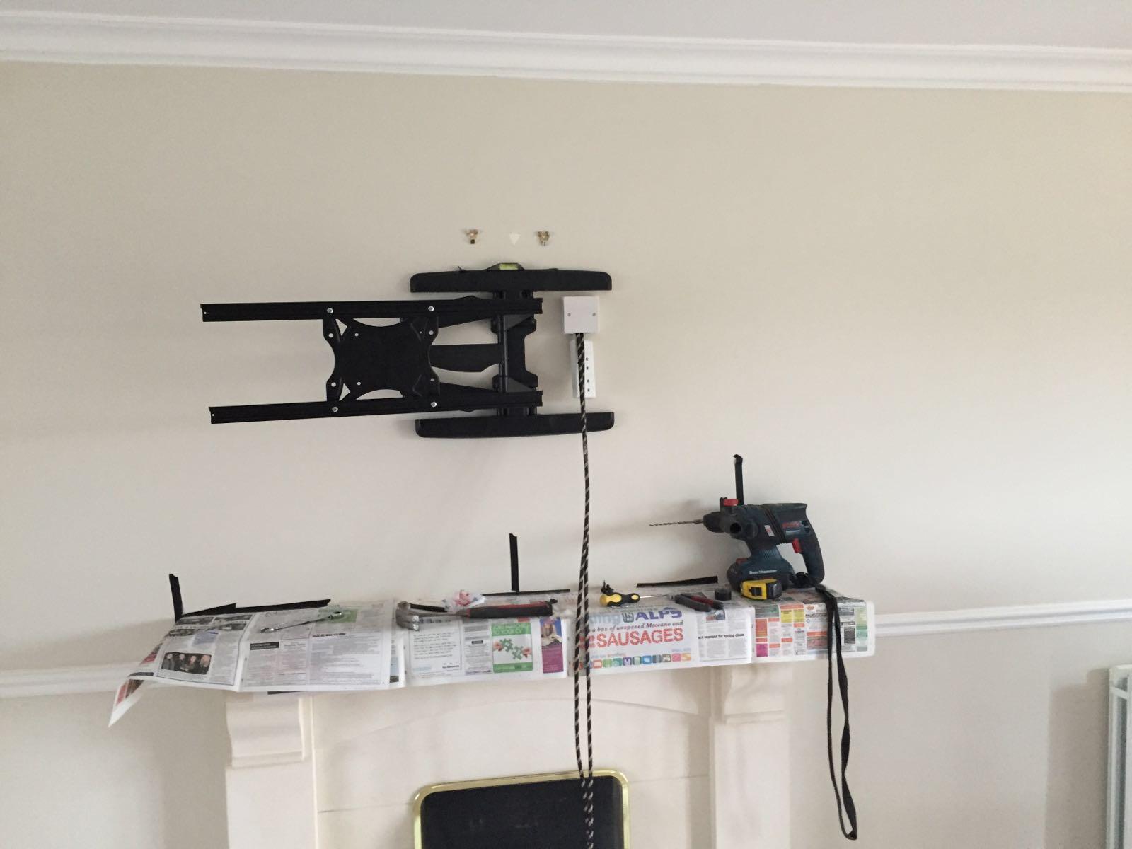 Articulating TV wall bracket fixed to a plastered wall