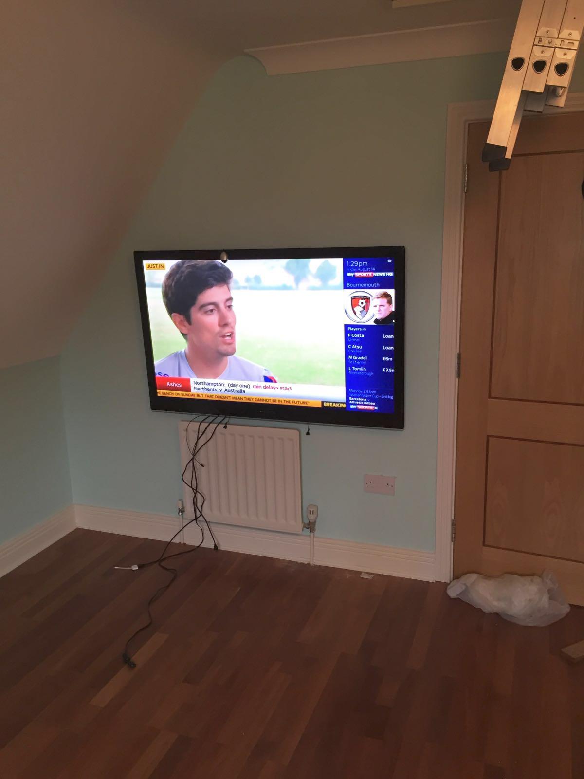 Bedroom TV wall mount installation with tidy cable management